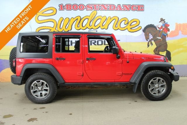 2017 Jeep Wrangler Unlimited Rubicon in Firecracker Red — front three-quarter view