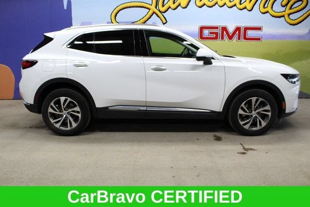 2023 Buick Envision Essence in Summit White — front three-quarter view