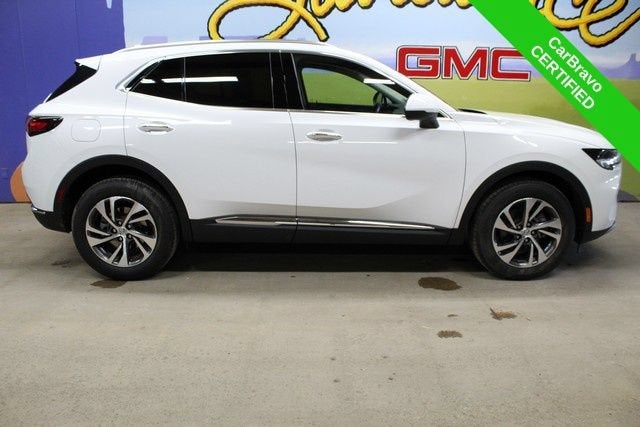 2023 Buick Envision Essence in Summit White — front three-quarter view