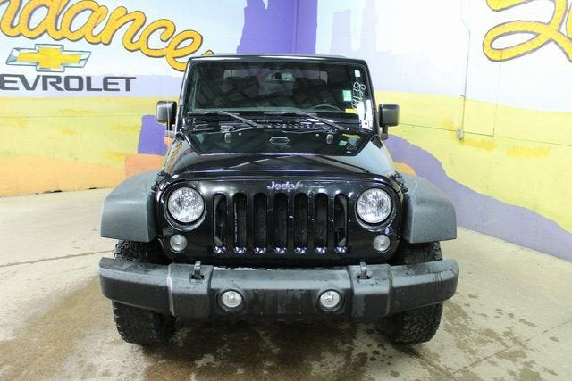 2015 Jeep Wrangler — rear three-quarter view