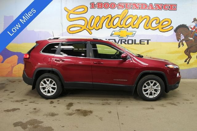 2017 Jeep Cherokee Latitude in Deep Cherry Red — front three-quarter view