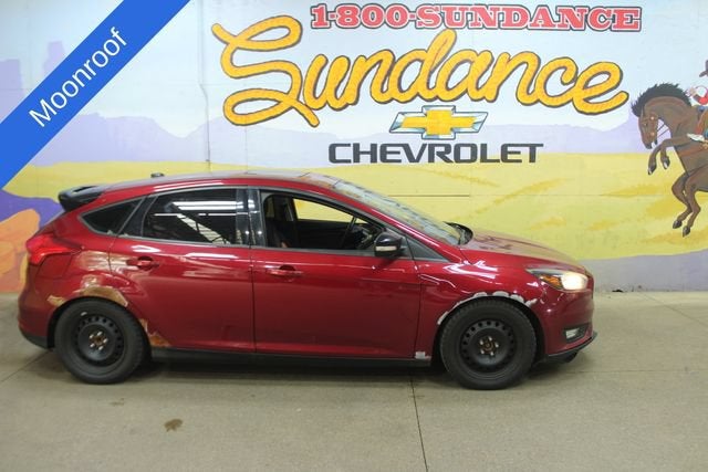 2016 Ford Focus SE in Red — front three-quarter view