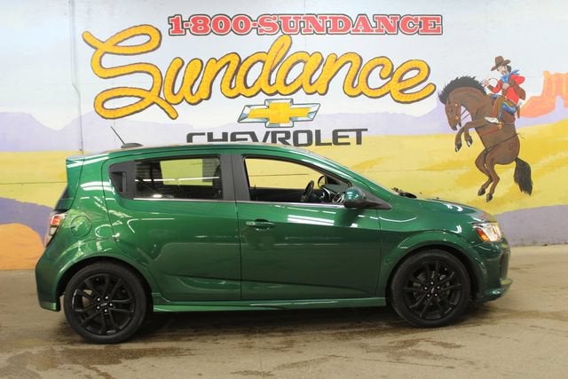 2018 Chevrolet Sonic Premier in Ivy Metallic — front three-quarter view