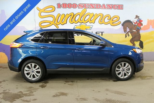 2021 Ford Edge Titanium in Blue — front three-quarter view