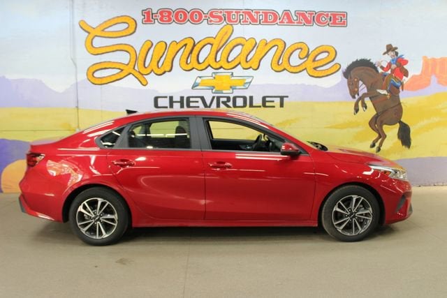 2024 Kia Forte LXS in Red — front three-quarter view